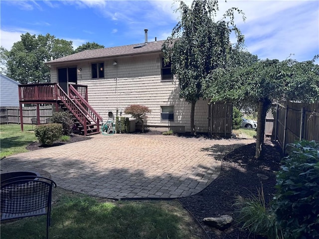 27 Brook St, West Warwick, RI 02893 - back of house with a wooden deck, a patio area, stairs, and roof with shingles