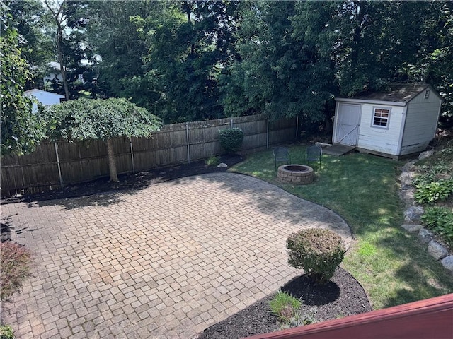 27 Brook St, West Warwick, RI 02893 - view of yard featuring a patio, a fire pit, and a shed