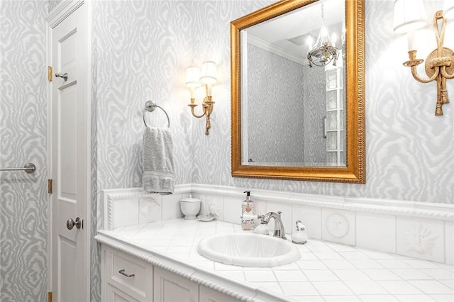 15 Courageous Cir, Bristol, RI 02809 - bathroom featuring wallpapered walls, vanity, and crown molding