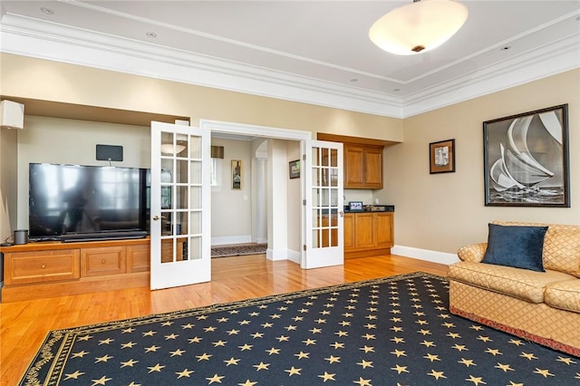 15 Courageous Cir, Bristol, RI 02809 - living room featuring french doors, wood finished floors, and crown molding