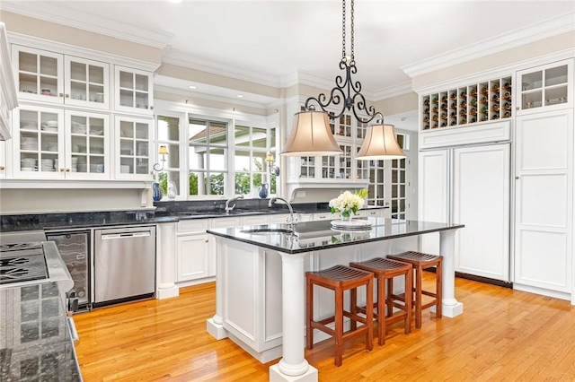 15 Courageous Cir, Bristol, RI 02809 - kitchen with dishwasher, light wood-style floors, white cabinets, ornamental molding, and paneled built in fridge