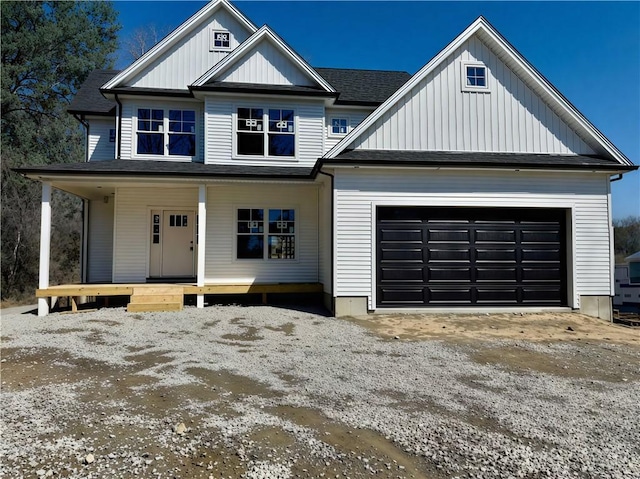 94 Ashaway Rd, Westerly, RI 02891 - view of front of house featuring a garage, board and batten siding, a porch, and driveway
