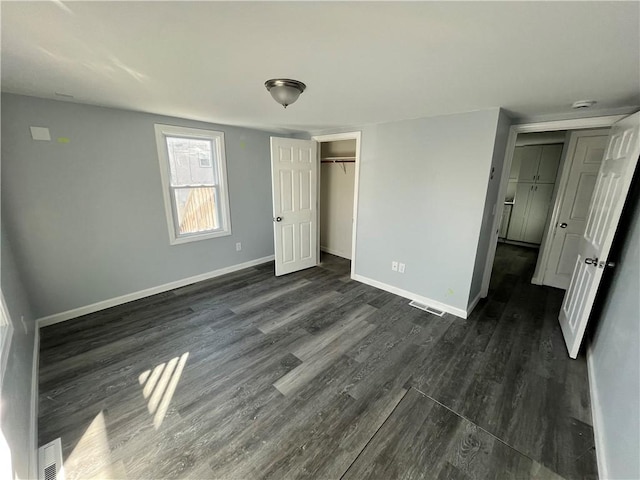 22 Agnes St, West Warwick, RI 02893 - unfurnished bedroom with dark wood finished floors and a closet