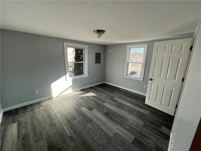 22 Agnes St, West Warwick, RI 02893 - empty room featuring electric panel and dark wood-style flooring