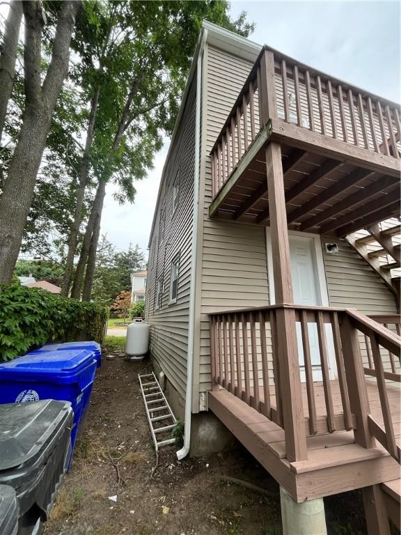 22 Agnes St, West Warwick, RI 02893 - view of side of home with a wooden deck