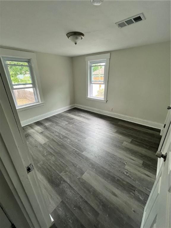 22 Agnes St, West Warwick, RI 02893 - empty room with dark wood-style floors and baseboards