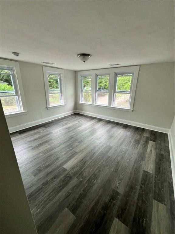 22 Agnes St, West Warwick, RI 02893 - spare room featuring dark wood-style floors and plenty of natural light