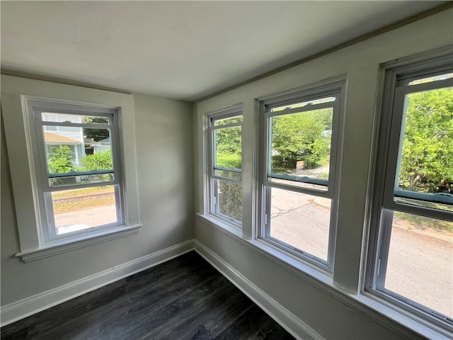 22 Agnes St, West Warwick, RI 02893 - spare room featuring dark wood-style flooring and plenty of natural light