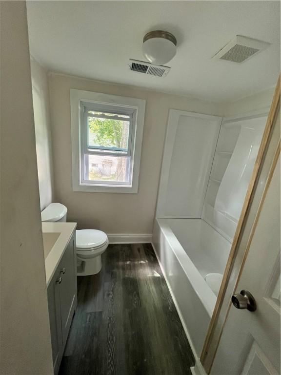 22 Agnes St, West Warwick, RI 02893 - bathroom featuring vanity, wood finished floors, and bathtub / shower combination