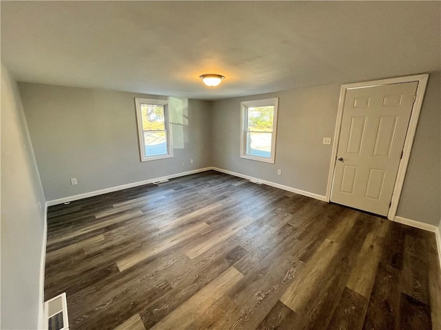 22 Agnes St, West Warwick, RI 02893 - unfurnished room with dark wood-style floors and baseboards