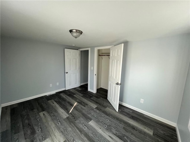 22 Agnes St, West Warwick, RI 02893 - unfurnished bedroom featuring dark wood-type flooring and a closet