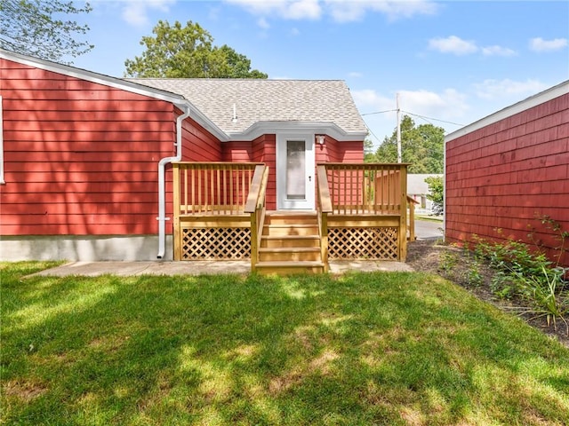 10 Palmer St, Smithfield, RI 02828 - back of house with a shingled roof, a deck, and a lawn