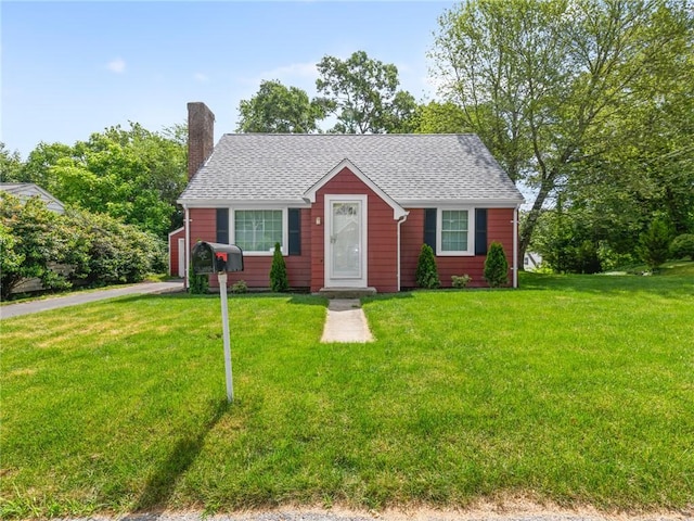 10 Palmer St, Smithfield, RI 02828 - view of front of home featuring a chimney, a front lawn, a shingled roof, and a garage