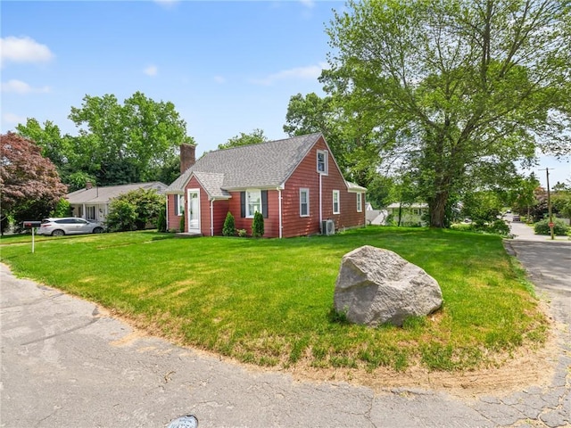 10 Palmer St, Smithfield, RI 02828 - view of front of home featuring a chimney, a front yard, and roof with shingles