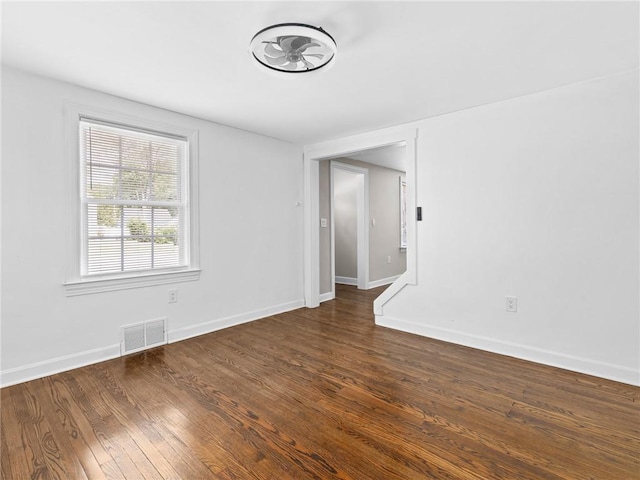 10 Palmer St, Smithfield, RI 02828 - empty room with wood finished floors and baseboards