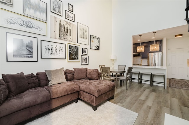 1000 Providence Pl Unit 467, Providence, RI 02903 - living room with light wood-type flooring and a high ceiling
