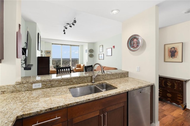 1 W Exchange St Unit 2802, Providence, RI 02903 - kitchen featuring stainless steel dishwasher, light stone counters, dark wood finished floors, a peninsula, and open floor plan