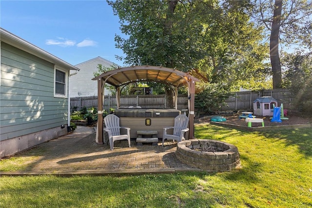 62 Pembroke Ln, Coventry, RI 02816 - fenced backyard featuring a hot tub and an outdoor fire pit