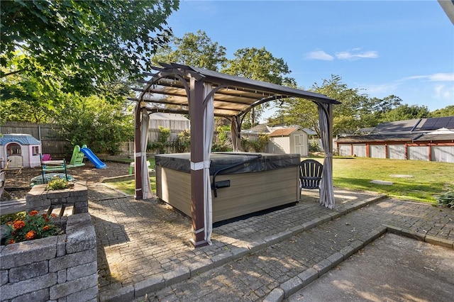 62 Pembroke Ln, Coventry, RI 02816 - fenced backyard with a hot tub, a storage shed, a patio area, a playground, and a pergola