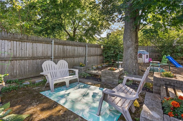 62 Pembroke Ln, Coventry, RI 02816 - fenced backyard with a patio area
