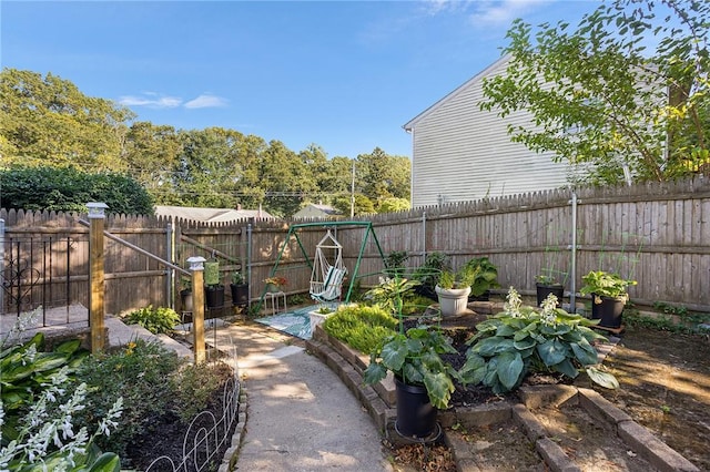 62 Pembroke Ln, Coventry, RI 02816 - fenced backyard featuring a vegetable garden