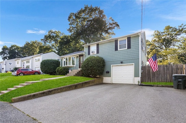 62 Pembroke Ln, Coventry, RI 02816 - tri-level home with a garage and asphalt driveway