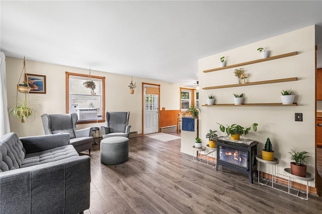 62 Pembroke Ln, Coventry, RI 02816 - living area featuring wood finished floors, cooling unit, baseboard heating, and a baseboard radiator