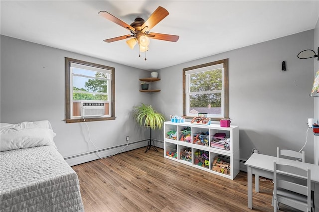 62 Pembroke Ln, Coventry, RI 02816 - bedroom featuring a baseboard heating unit, cooling unit, multiple windows, and wood finished floors