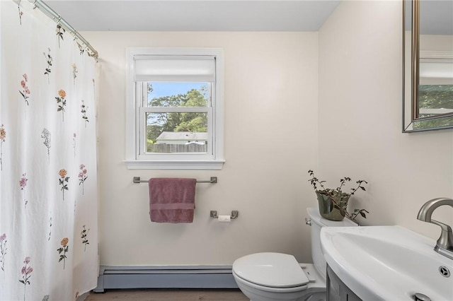 62 Pembroke Ln, Coventry, RI 02816 - bathroom featuring a baseboard heating unit, vanity, and curtained shower