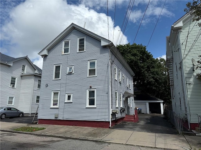 139 Julian St, Providence, RI 02909 - view of property exterior with an outbuilding and a detached garage