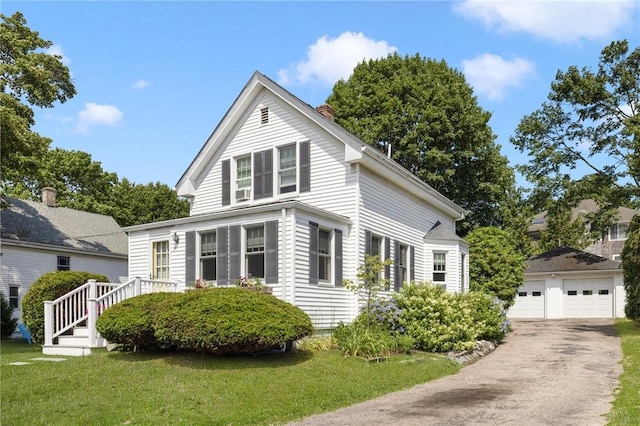 7 Pleasant Vw, Jamestown, RI 02835 - view of front of home featuring an outbuilding, a garage, a chimney, and a front lawn