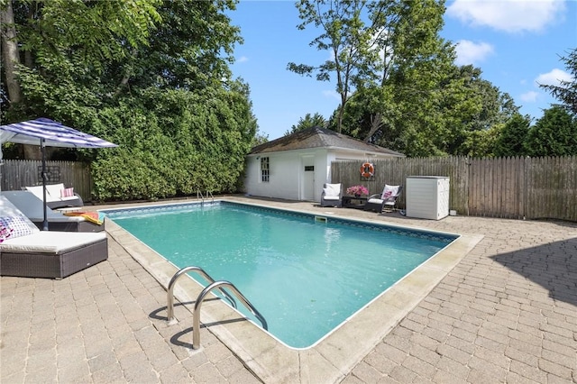 7 Pleasant Vw, Jamestown, RI 02835 - view of swimming pool featuring a patio area, a fenced backyard, and an outdoor structure
