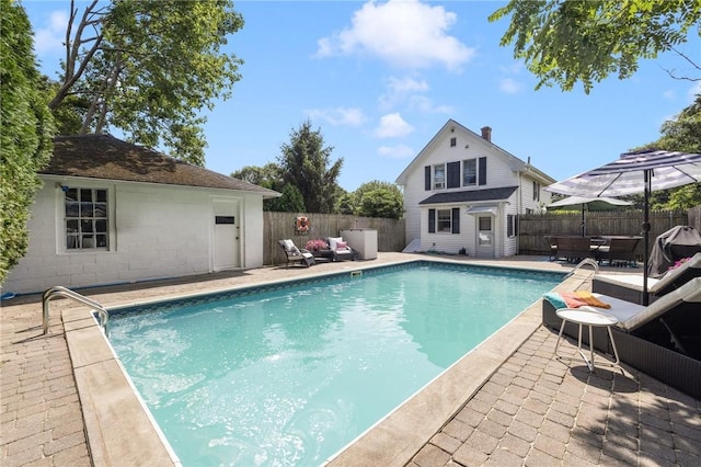 7 Pleasant Vw, Jamestown, RI 02835 - view of swimming pool featuring outdoor lounge area, an outbuilding, a fenced backyard, and a patio area