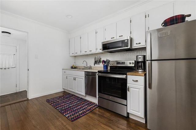 7 Pleasant Vw, Jamestown, RI 02835 - kitchen featuring appliances with stainless steel finishes, dark wood-style floors, white cabinetry, and ornamental molding