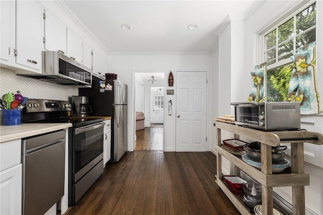 7 Pleasant Vw, Jamestown, RI 02835 - kitchen featuring stainless steel appliances, dark wood-type flooring, light countertops, white cabinetry, and crown molding