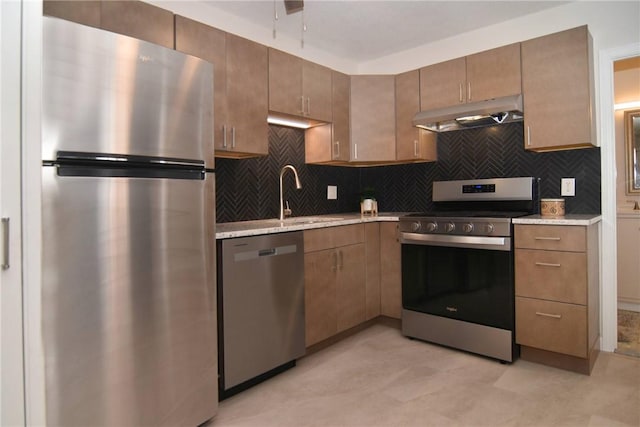 132 Hoffman Ave Unit 202, Cranston, RI 02920 - kitchen with stainless steel appliances, under cabinet range hood, backsplash, and light stone countertops