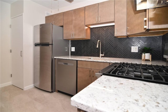 132 Hoffman Ave Unit 202, Cranston, RI 02920 - kitchen with appliances with stainless steel finishes, decorative backsplash, custom range hood, and brown cabinetry