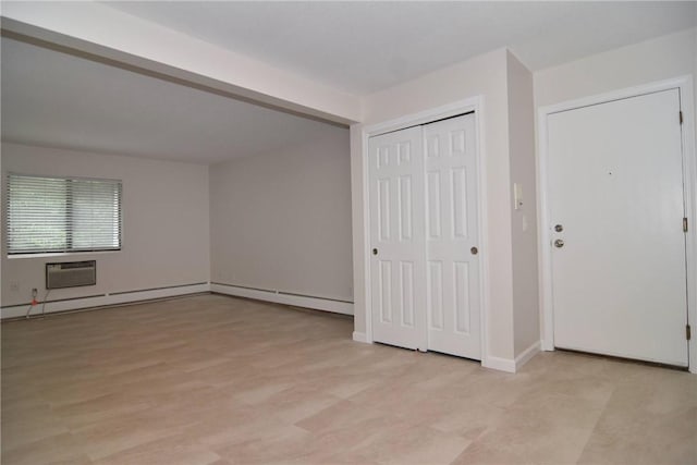 132 Hoffman Ave Unit 202, Cranston, RI 02920 - unfurnished bedroom with a wall unit AC, a closet, and a baseboard heating unit