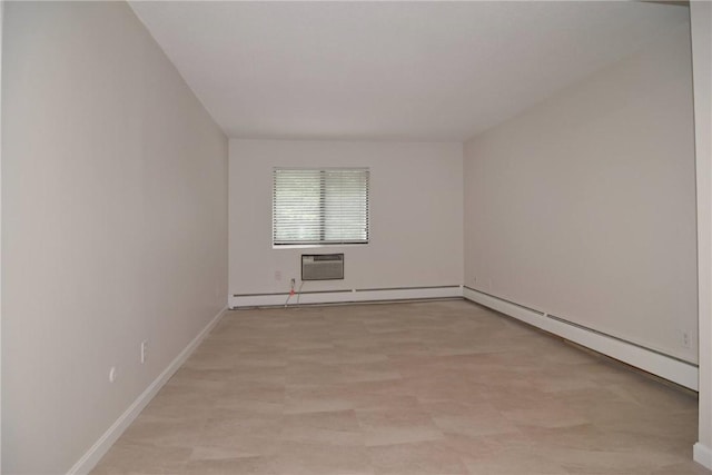 132 Hoffman Ave Unit 202, Cranston, RI 02920 - spare room with a baseboard radiator, a wall unit AC, and a baseboard heating unit