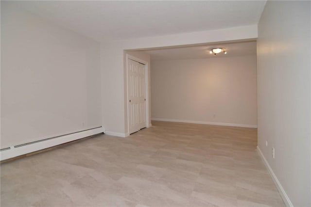 132 Hoffman Ave Unit 202, Cranston, RI 02920 - spare room featuring baseboard heating and baseboards