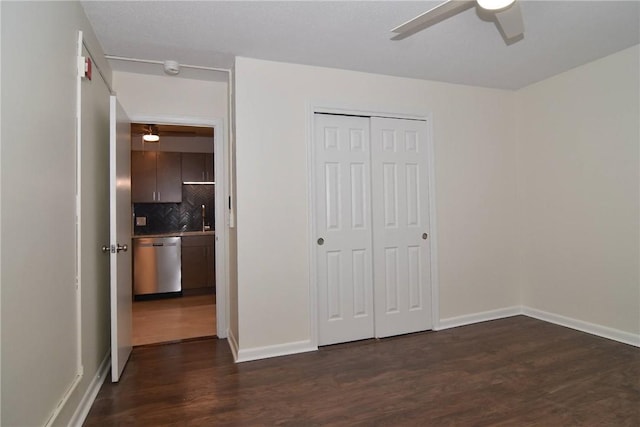 132 Hoffman Ave Unit 202, Cranston, RI 02920 - unfurnished bedroom with dark wood-type flooring, a closet, and a ceiling fan