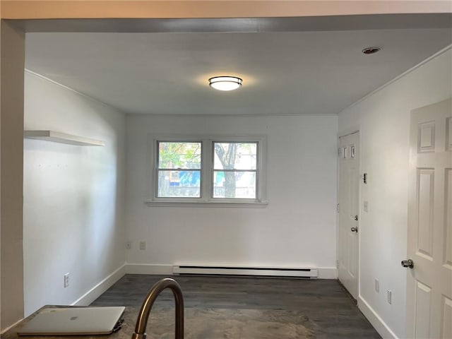 84 Tell St Unit 4A, Providence, RI 02909 - unfurnished room featuring a baseboard radiator and dark wood-type flooring