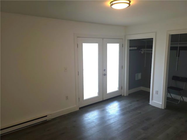 84 Tell St Unit 4A, Providence, RI 02909 - unfurnished bedroom with baseboard heating, french doors, multiple windows, and dark wood-style flooring