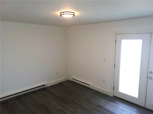 84 Tell St Unit 4A, Providence, RI 02909 - spare room featuring a baseboard heating unit, dark wood-style flooring, and healthy amount of natural light