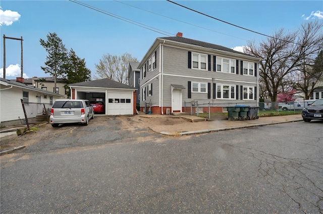 15 Melissa St, Providence, RI 02909 - view of front of property with a detached garage, an outdoor structure, and a chimney