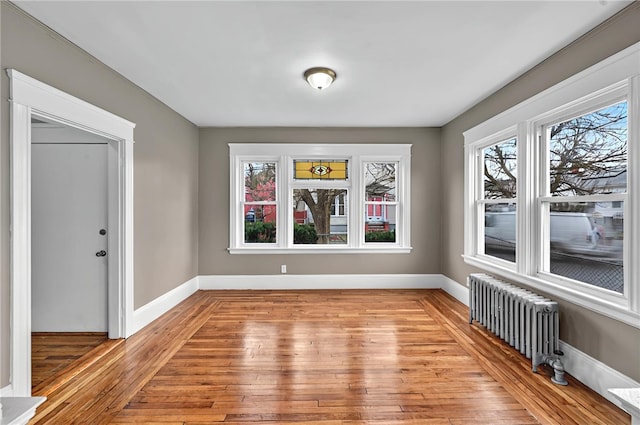 15 Melissa St, Providence, RI 02909 - unfurnished dining area featuring radiator and light wood finished floors