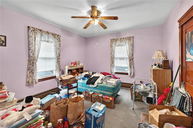 15 Melissa St, Providence, RI 02909 - carpeted bedroom with multiple windows, a baseboard heating unit, and ceiling fan
