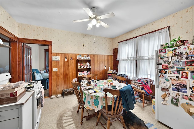 15 Melissa St, Providence, RI 02909 - dining room with wallpapered walls, healthy amount of natural light, a wainscoted wall, a ceiling fan, and wood walls