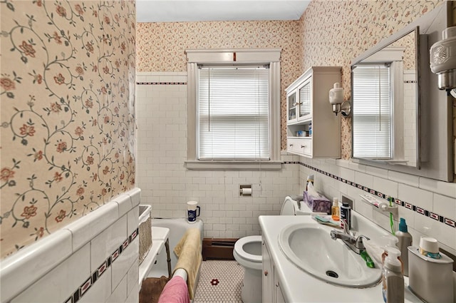 15 Melissa St, Providence, RI 02909 - bathroom featuring wallpapered walls, vanity, a baseboard heating unit, a wainscoted wall, and tile walls