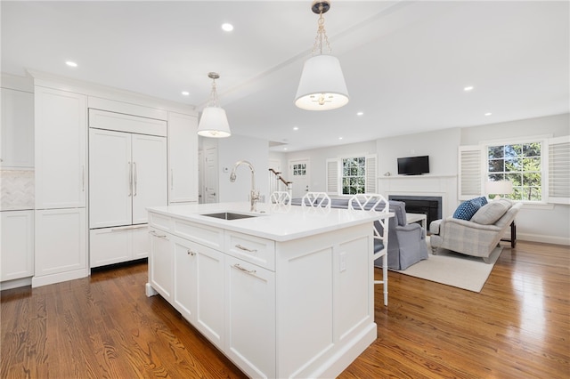 10 Linden Gate Ln, Newport, RI 02840 - kitchen featuring paneled fridge, a fireplace, dark wood-style floors, plenty of natural light, and recessed lighting